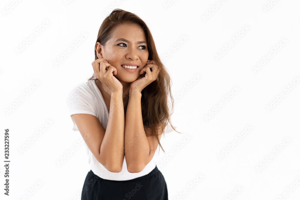Pensive positive girl planning nice event. Beautiful smiling young woman leaning chin on hands and looking into distance. Planning concept Pensive positive girl planning nice event. Beautiful smiling young woman leaning chin on hands and looking into distance. Planning concept
