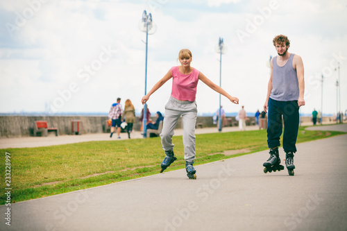 Active young people friends rollerskating.