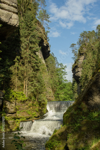 Bohemian Switzerland National Park. Landscape with mountain river with many rocks and pines. Czech Switzerland forest.