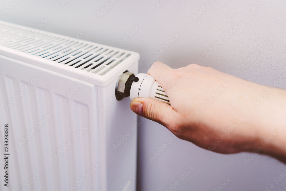 Man hand at battery temperature controller heating close up Man hand at battery temperature controller heating close up