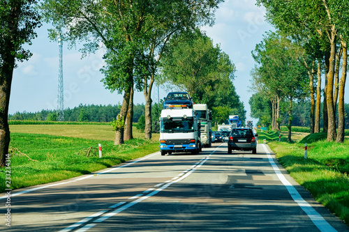 Cars carriers on road in Poland