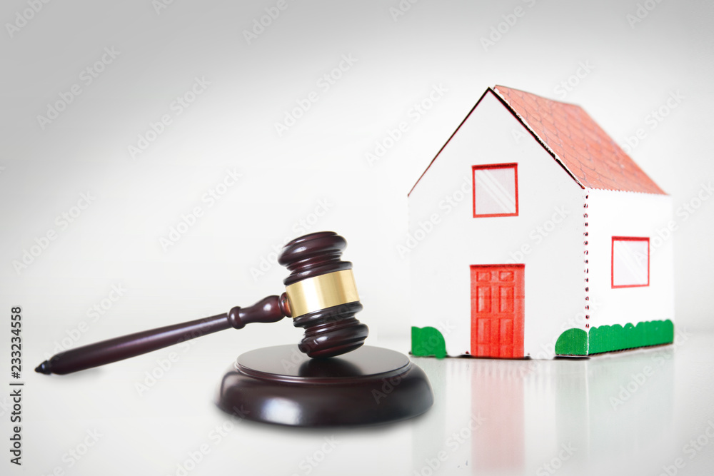 Auction or Judgment hammer for a real state case against a white background. Empty copy space for Editor's text. Auction or Judgment hammer for a real state case against a white background. Empty copy space for Editor's text.