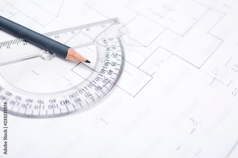 Pencil on a transparent protractor on the table in the draftsman Pencil on a transparent protractor on the table in the draftsman