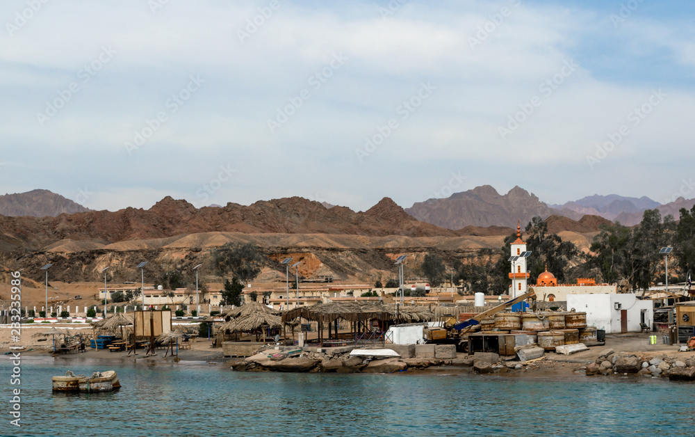 fishing village on the coast of the Red Sea against the backdrop of the mountains of Egypt