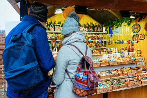 Photography Couple at Wooden souvenirs stand at Christmas Market Gendarmenmarkt Berlin