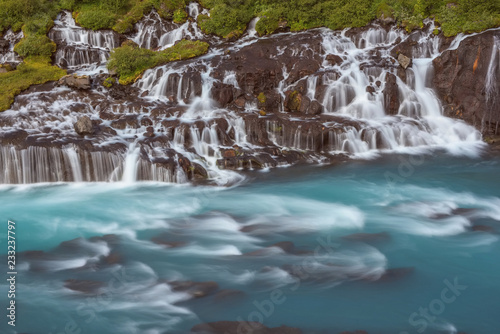 The Hraunfossar - an amazing blue cascade waterfall in Iceland