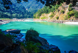 seemless flow of river ganges in the daylight. rishikesh. enjoy view at foolchati with sand and rocks in background