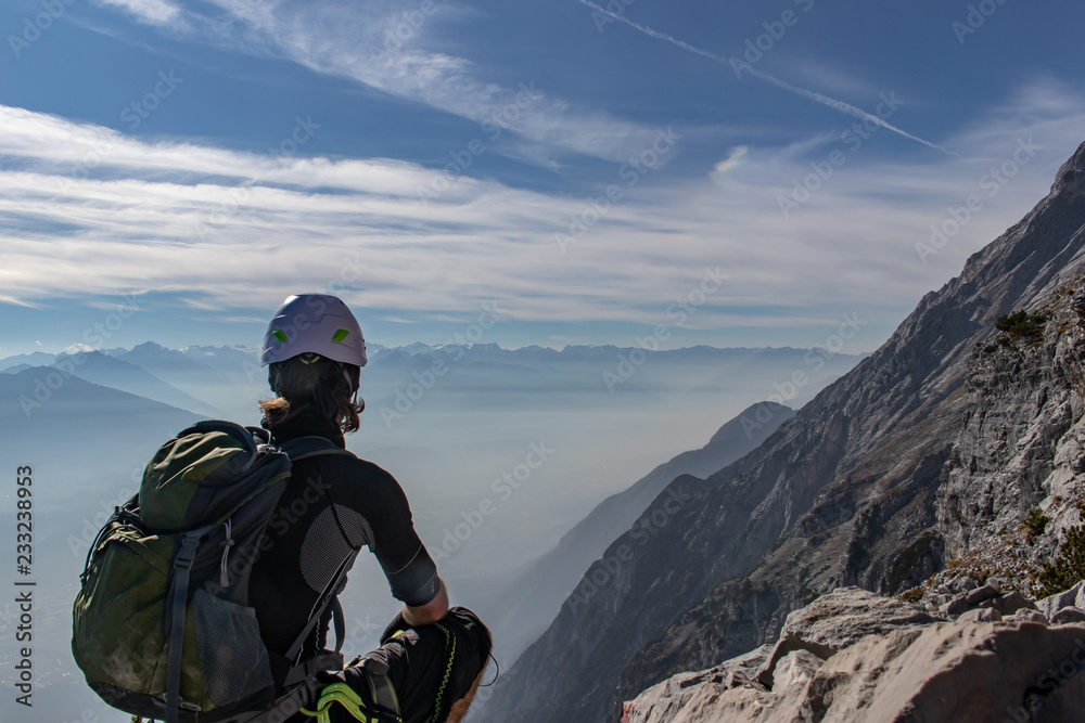 Mountaineer viewing down to the Innvalley from a mountain called Hundkopf in the Karwendel Mountains, European Alps, Austria