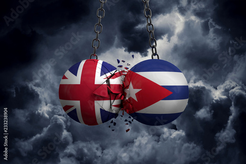 Canvas Print United Kingdom and Cuba flag political balls smash into each other