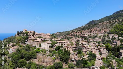 Flight over Mountain Village Deia in Mallorca Tramuntana Mountains, Region Valldemossa and Soller photo