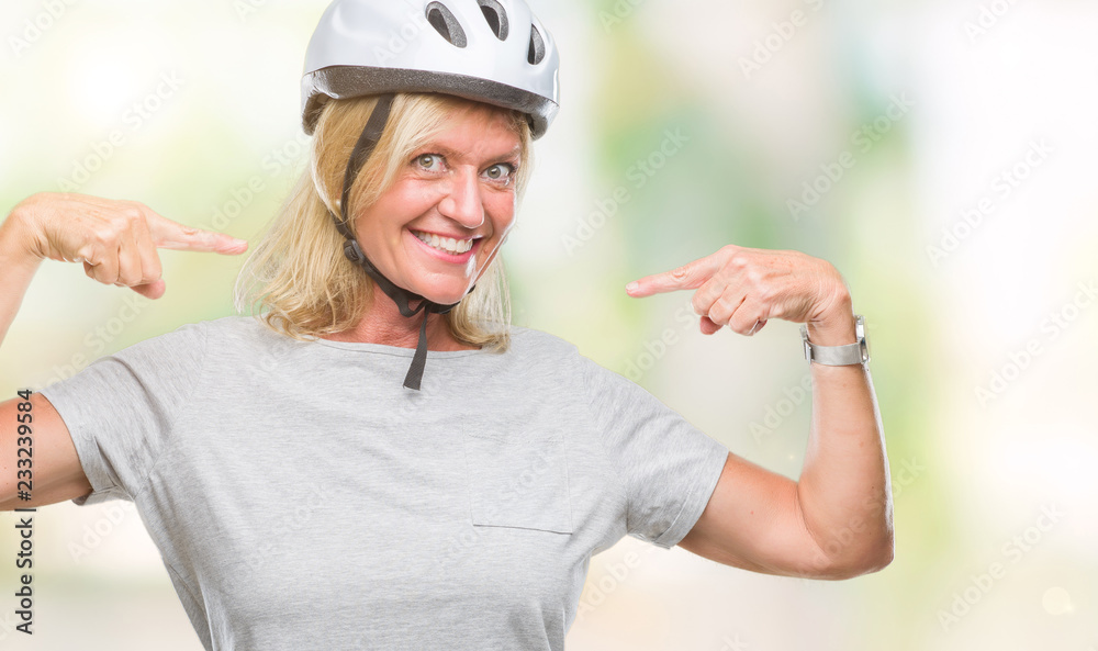 Middle age caucasian cyclist woman wearing safety helmet over isolated background looking confident with smile on face, pointing oneself with fingers proud and happy. Middle age caucasian cyclist woman wearing safety helmet over isolated background looking confident with smile on face, pointing oneself with fingers proud and happy.