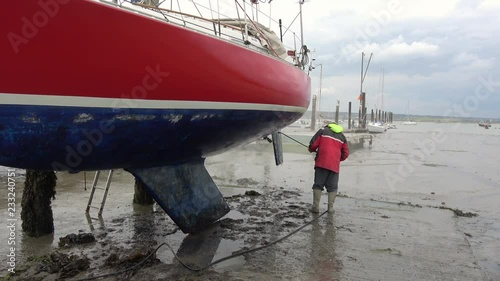 Jet washing the hull of a yacht 