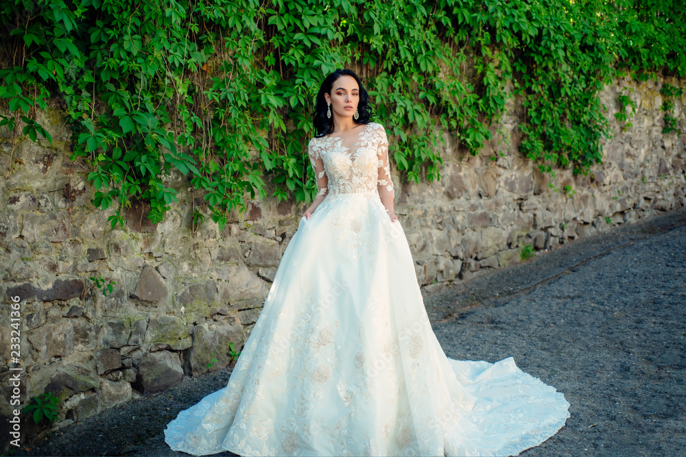 Wonderful bridal gown. Beautiful wedding dresses in boutique. Elegant wedding salon is waiting for bride. woman is preparing for wedding. Happy bride before wedding. Extremely happy Wonderful bridal gown. Beautiful wedding dresses in boutique. Elegant wedding salon is waiting for bride. woman is preparing for wedding. Happy bride before wedding. Extremely happy
