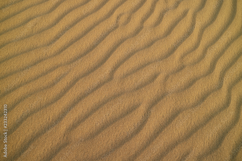 Impressive sand ripple pattern on the sand dune of Huacachina desert, Ica, Peru Impressive sand ripple pattern on the sand dune of Huacachina desert, Ica, Peru