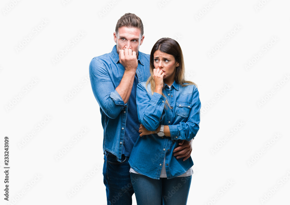 Young couple in love over isolated background looking stressed and nervous with hands on mouth biting nails. Anxiety problem. Young couple in love over isolated background looking stressed and nervous with hands on mouth biting nails. Anxiety problem.