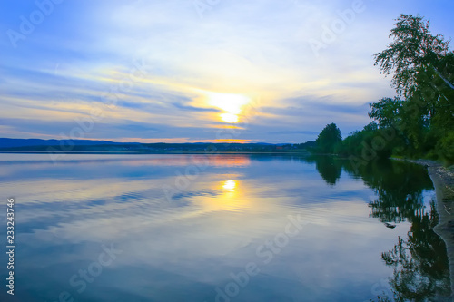 sunset over the lake in summer