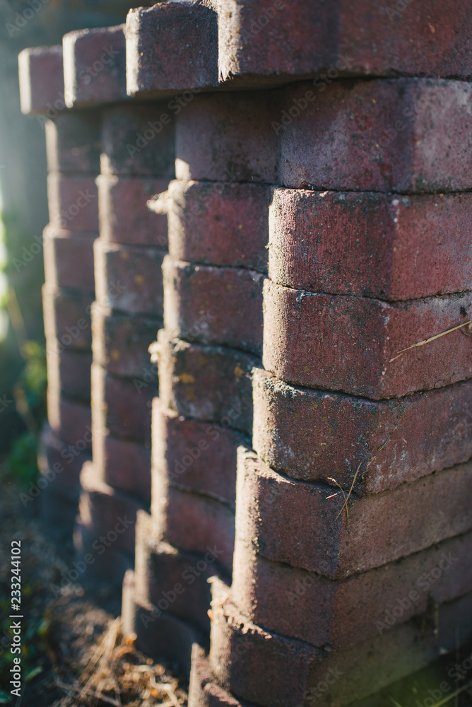 Naklejka premium Brickwork on the street in the summer sunlight.