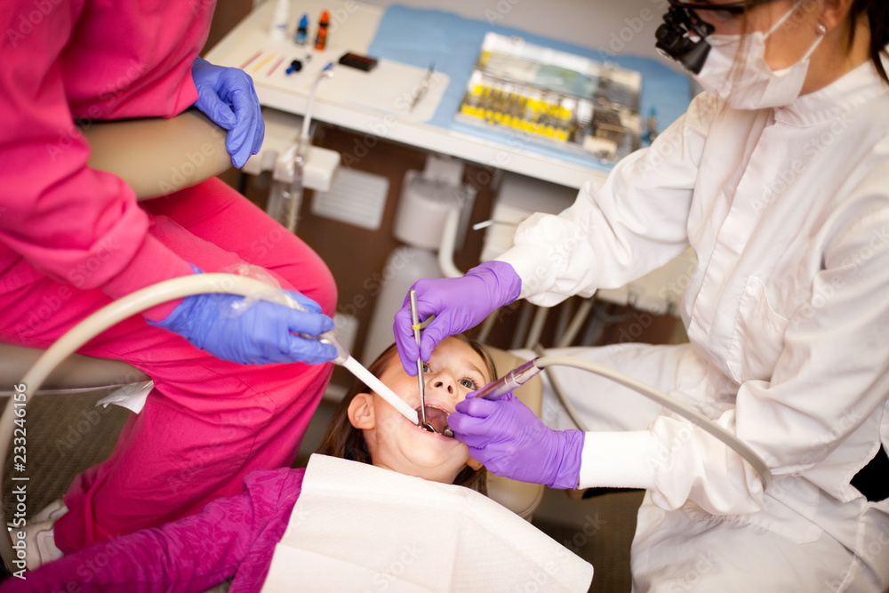 Young Girl at Dentist Getting Teeth Cleaned Young Girl at Dentist Getting Teeth Cleaned