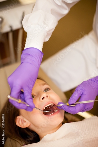 Young Girl at Dentist Getting Teeth Cleaned