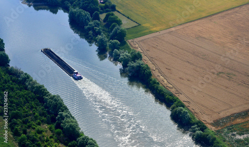 Rosny sur Seine, France - july 7 2017 : aerial photography of a barge on the Seine riverside photo