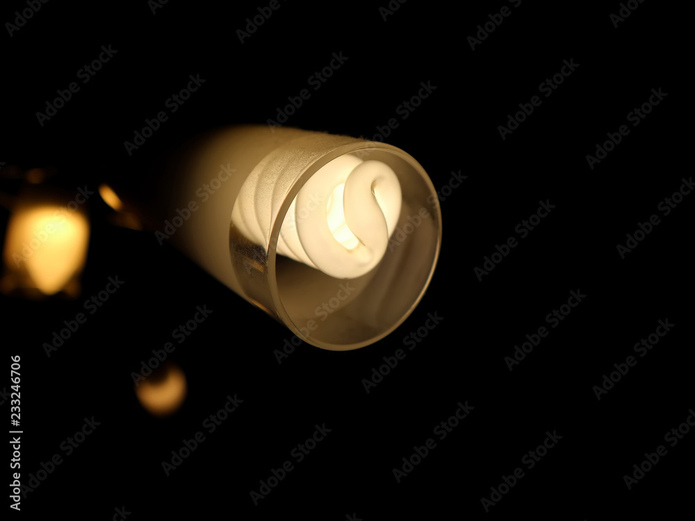 Ceiling lamp glowing in the black background Ceiling lamp glowing in the black background