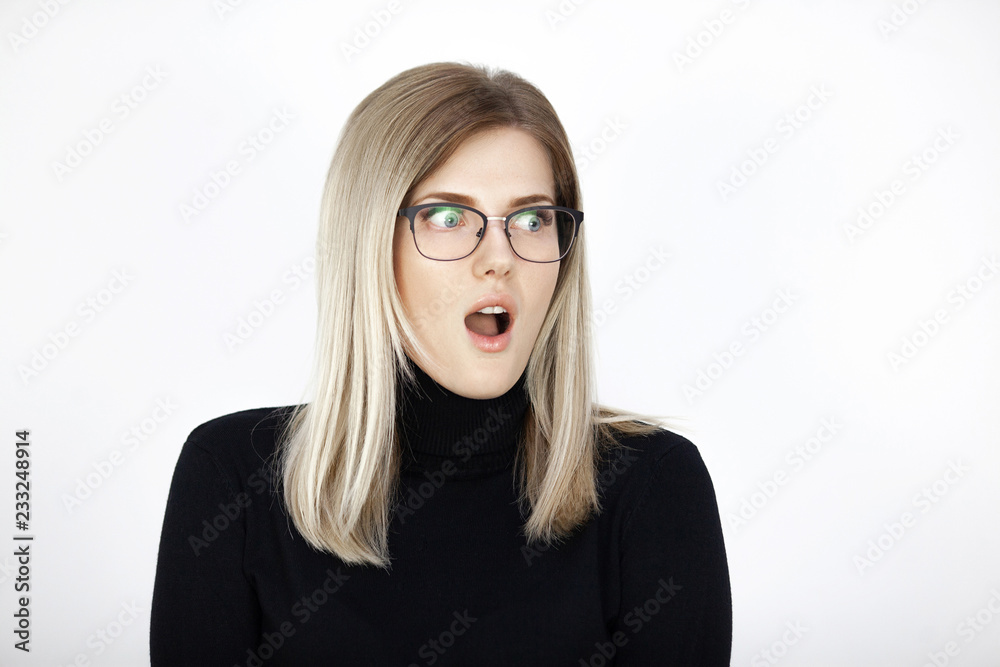 Young attractive blonde is extremely surprised Young attractive blonde is extremely surprised