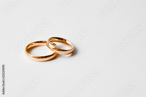 gold engagement rings on white background