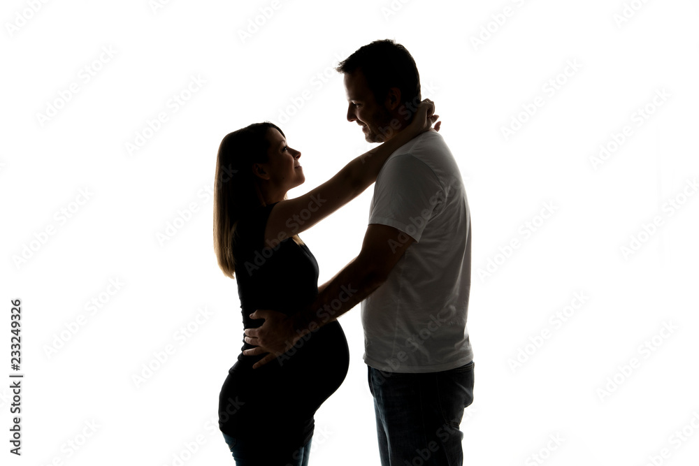 A Pregnant woman with man on studio isolated on white A Pregnant woman with man on studio isolated on white