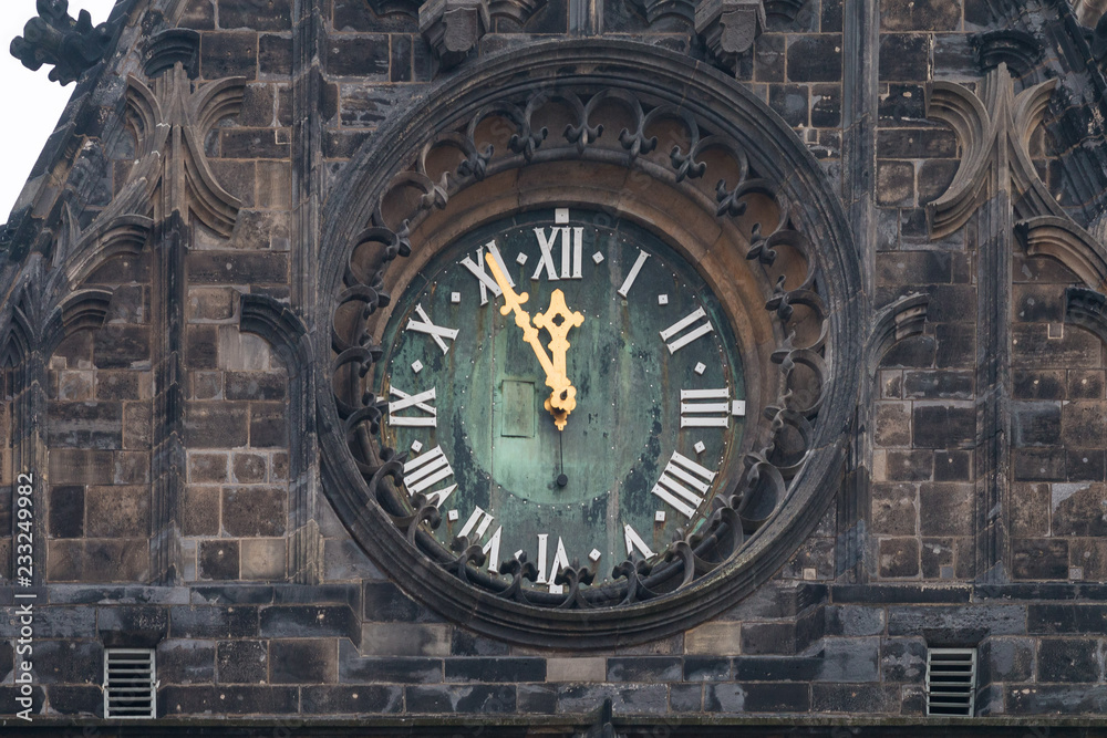 Tower clock five minutes to twelve Tower clock five minutes to twelve