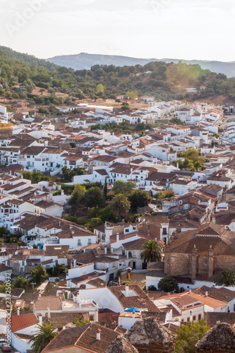 Aerial view at sunset of the village with white houses of Cortegana, in the saw of Huelva, Spain