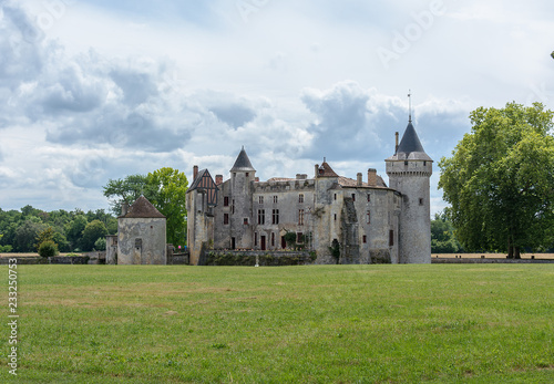 The Chateau de La Brede is a feudal castle in the commune of La Brede in the departement of Gironde, France. Summer cloudy day photo