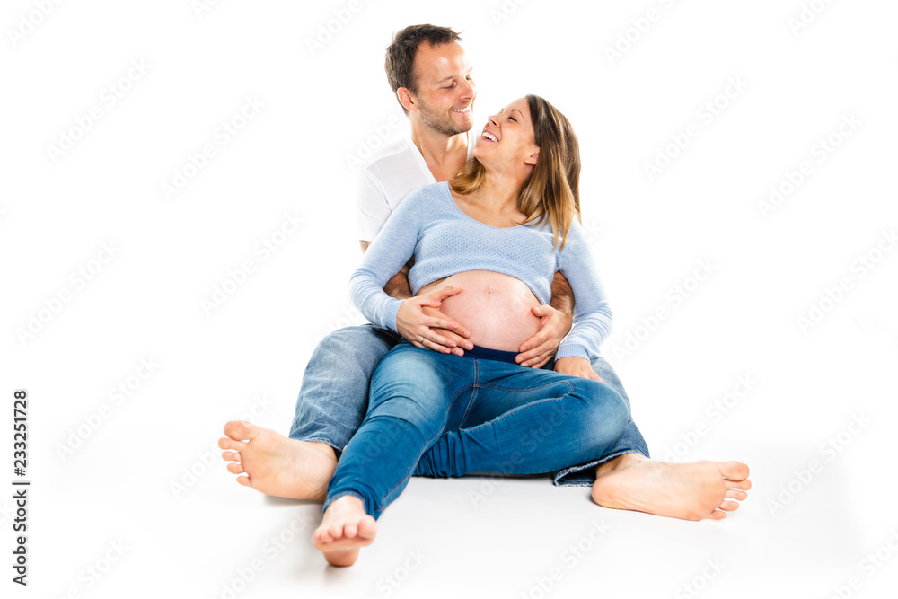 A Pregnant woman with man on studio isolated on white A Pregnant woman with man on studio isolated on white
