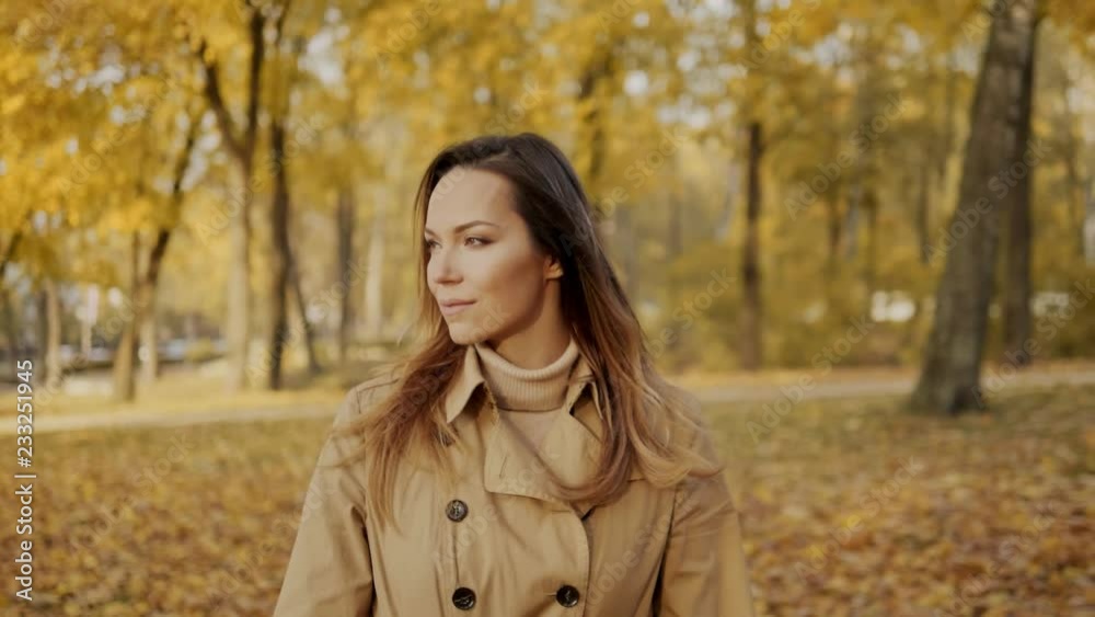 Beautiful happy woman walking in a forest Beautiful happy woman walking in a forest