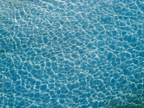 Aerial view of water reflections on the sea