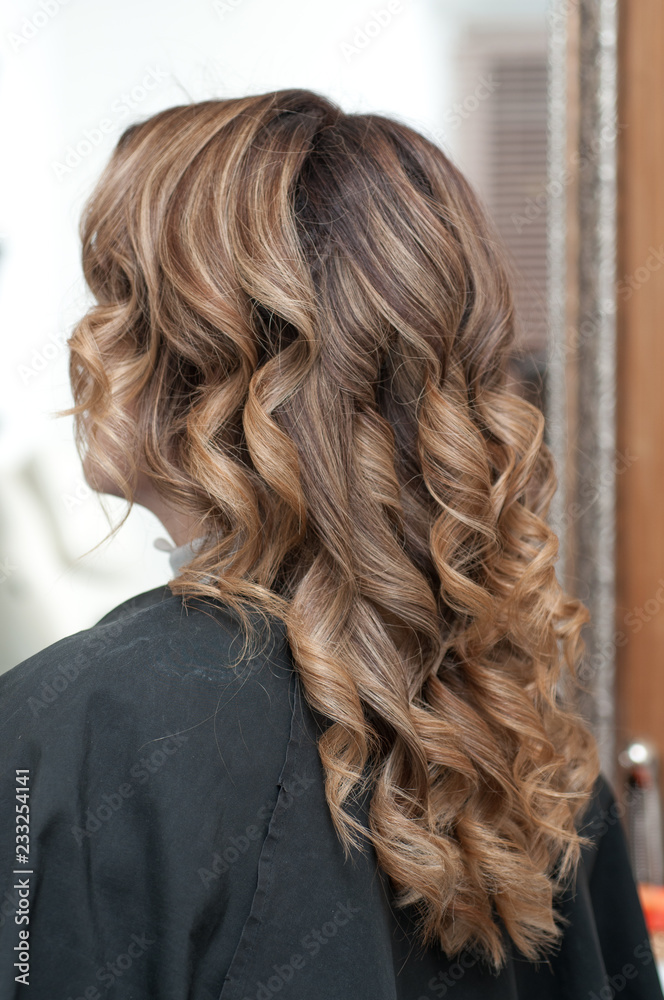 Naklejka premium hairstyle female curls on dark hair