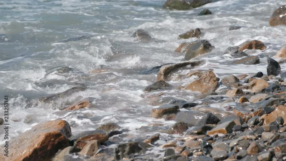 Beautiful strong waves on the stone beach. Beautiful strong waves on the stone beach.