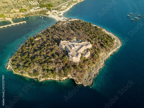 Aerial view of Porto Palermo Castle on island with beautiful Mediterranean waters in Himara, Albania 