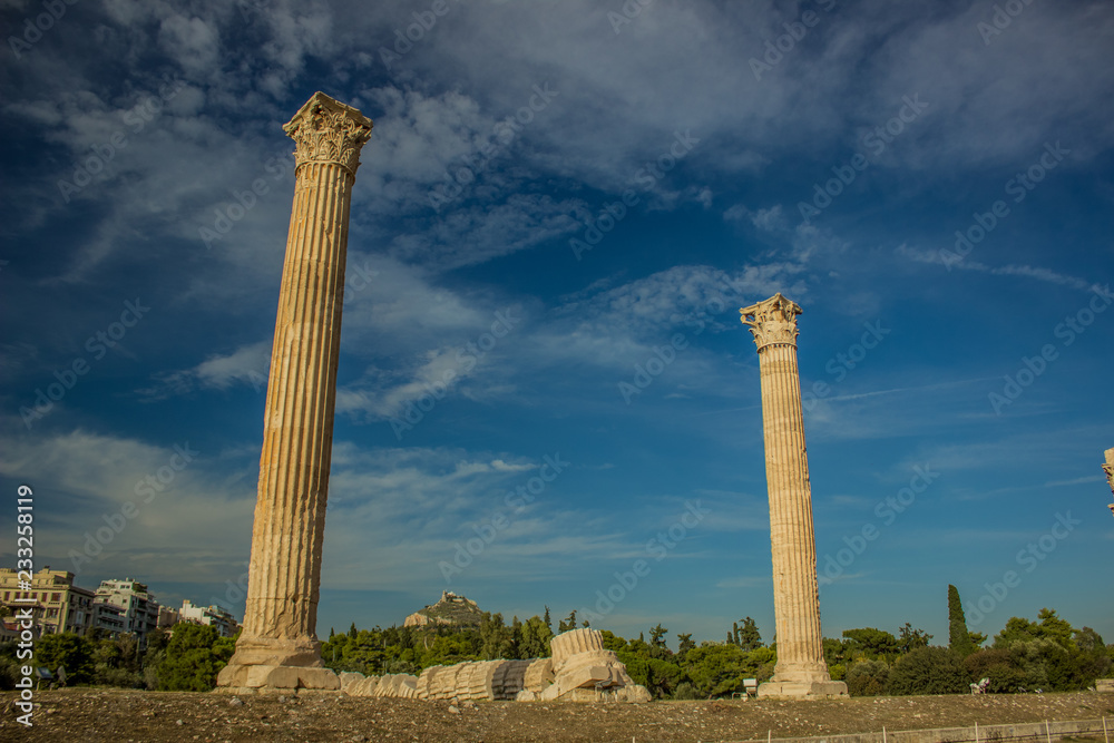 Ancient Greece open air museum with colonnade ruins of destroyed by time antique temple and space for sightseeing for people, clear colorful summer weather Ancient Greece open air museum with colonnade ruins of destroyed by time antique temple and space for sightseeing for people, clear colorful summer weather