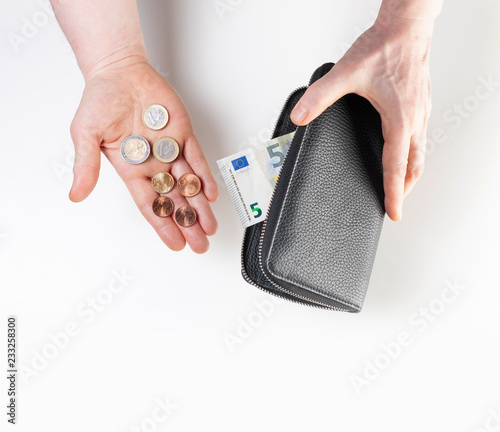 Slika na platnu Minimum wage in Germany, purse with 9,19 euro banknotes and coins
