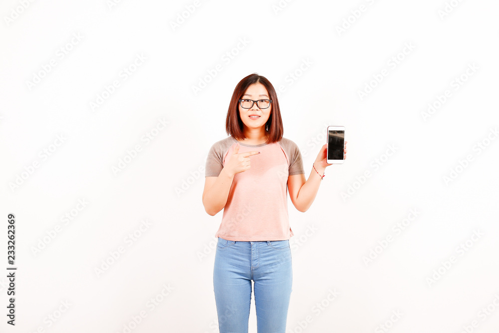 Portrait of beautiful asian young woman with brunette hair and bob hairstyle, fashionable hipster outfit alone in bright lighted room. Background, copy space for text, close up. Portrait of beautiful asian young woman with brunette hair and bob hairstyle, fashionable hipster outfit alone in bright lighted room. Background, copy space for text, close up.