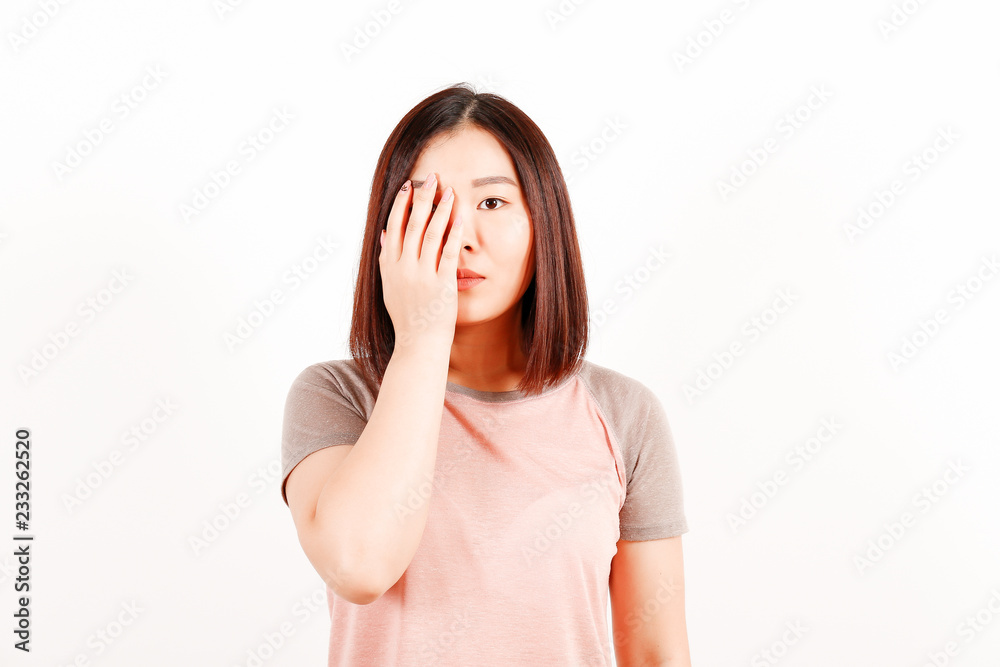Portrait of beautiful asian young woman with brunette hair and bob hairstyle, fashionable hipster outfit alone in bright lighted room. Background, copy space for text, close up. Portrait of beautiful asian young woman with brunette hair and bob hairstyle, fashionable hipster outfit alone in bright lighted room. Background, copy space for text, close up.