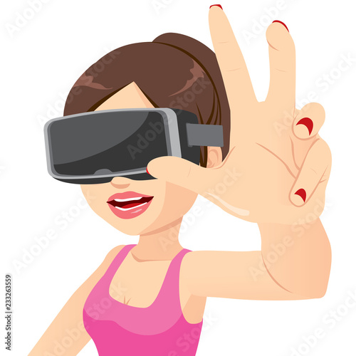 Happy young woman enjoying virtual trying to grasp something headset experience