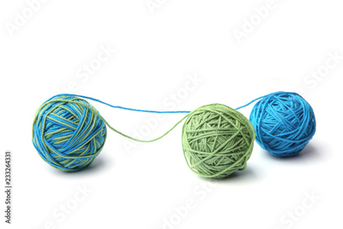 Colorful cotton thread ball from two color green and blue thread isolated on white background. Different color green and blue thread mix.