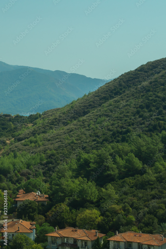 Mountain town panoramic view. city between the hills Mountain town panoramic view. city between the hills