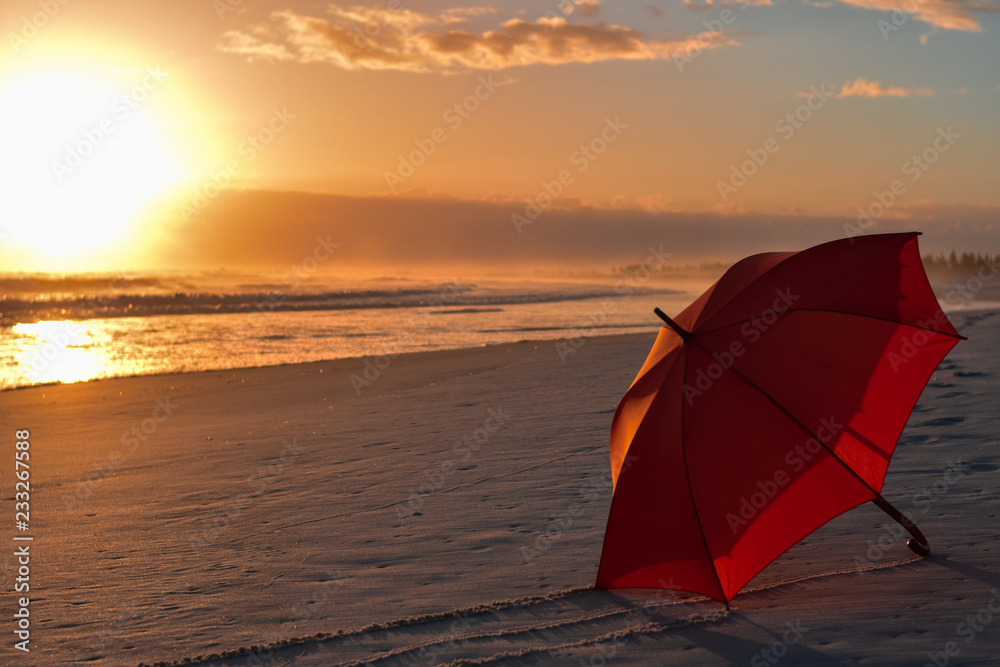 umbrella on the beach at sunset