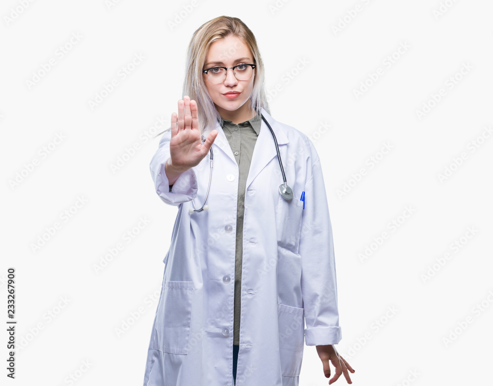 Young blonde doctor woman over isolated background doing stop sing with palm of the hand. Warning expression with negative and serious gesture on the face. Young blonde doctor woman over isolated background doing stop sing with palm of the hand. Warning expression with negative and serious gesture on the face.