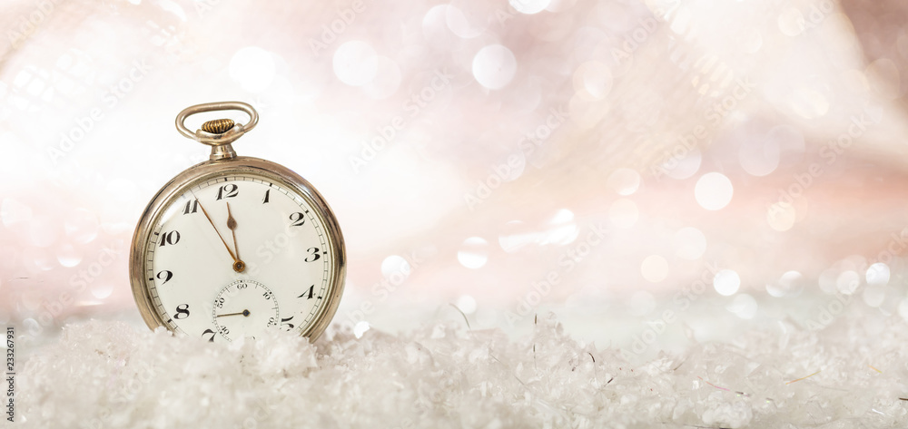 New Years eve. Minutes to midnight on an old fashioned pocket watch