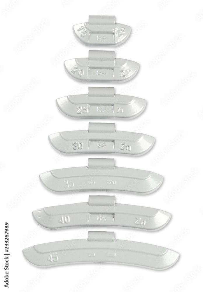 Clip-on zinc tire weights in different sizes, from above. Correction wheel weights, to mount on the rims to create a better mass distribution and balance. Free from lead, environmental friendly. Photo Clip-on zinc tire weights in different sizes, from above. Correction wheel weights, to mount on the rims to create a better mass distribution and balance. Free from lead, environmental friendly. Photo