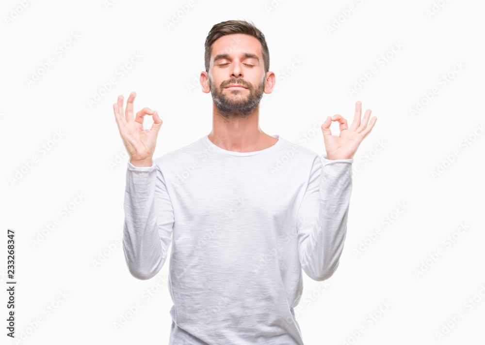 Young handsome man over isolated background relax and smiling with eyes closed doing meditation gesture with fingers. Yoga concept. Young handsome man over isolated background relax and smiling with eyes closed doing meditation gesture with fingers. Yoga concept.