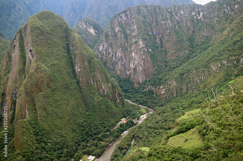 Incredible mountain ranges and the town of Aguas Calientes view from Huayna Picchu mountain, Cusco Region, Urubamba Province of Peru photo